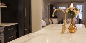 Calacatta Lincoln honed marble with unlaquered brass plumbing fixtures